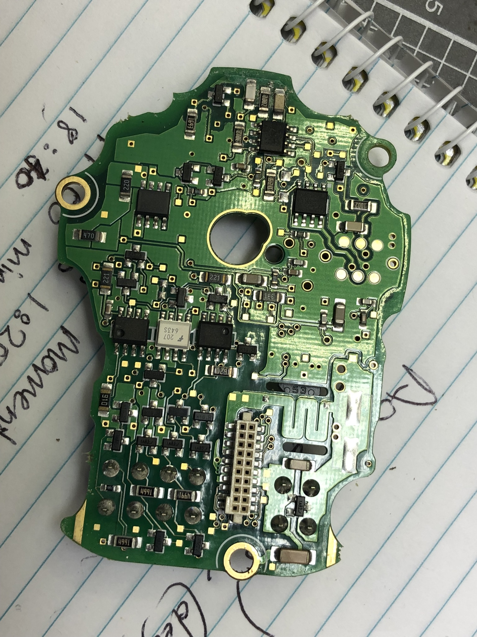 Back face of encoder PCB with optocouplers, various SMD passives and some discrete regulation components