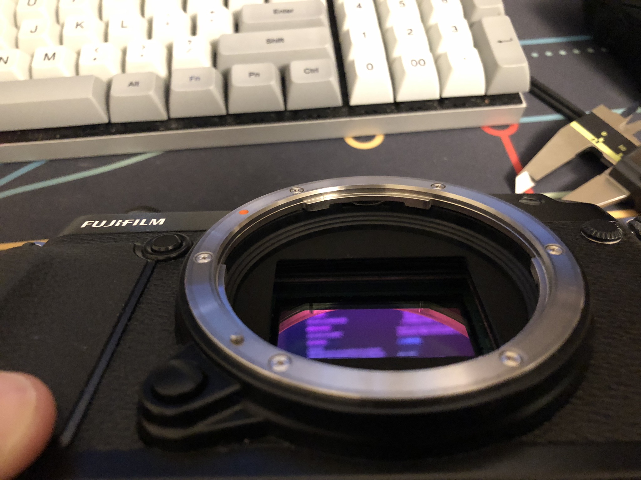 GFX 50R lens mount, protective glass, and sensor stack. Angled view.