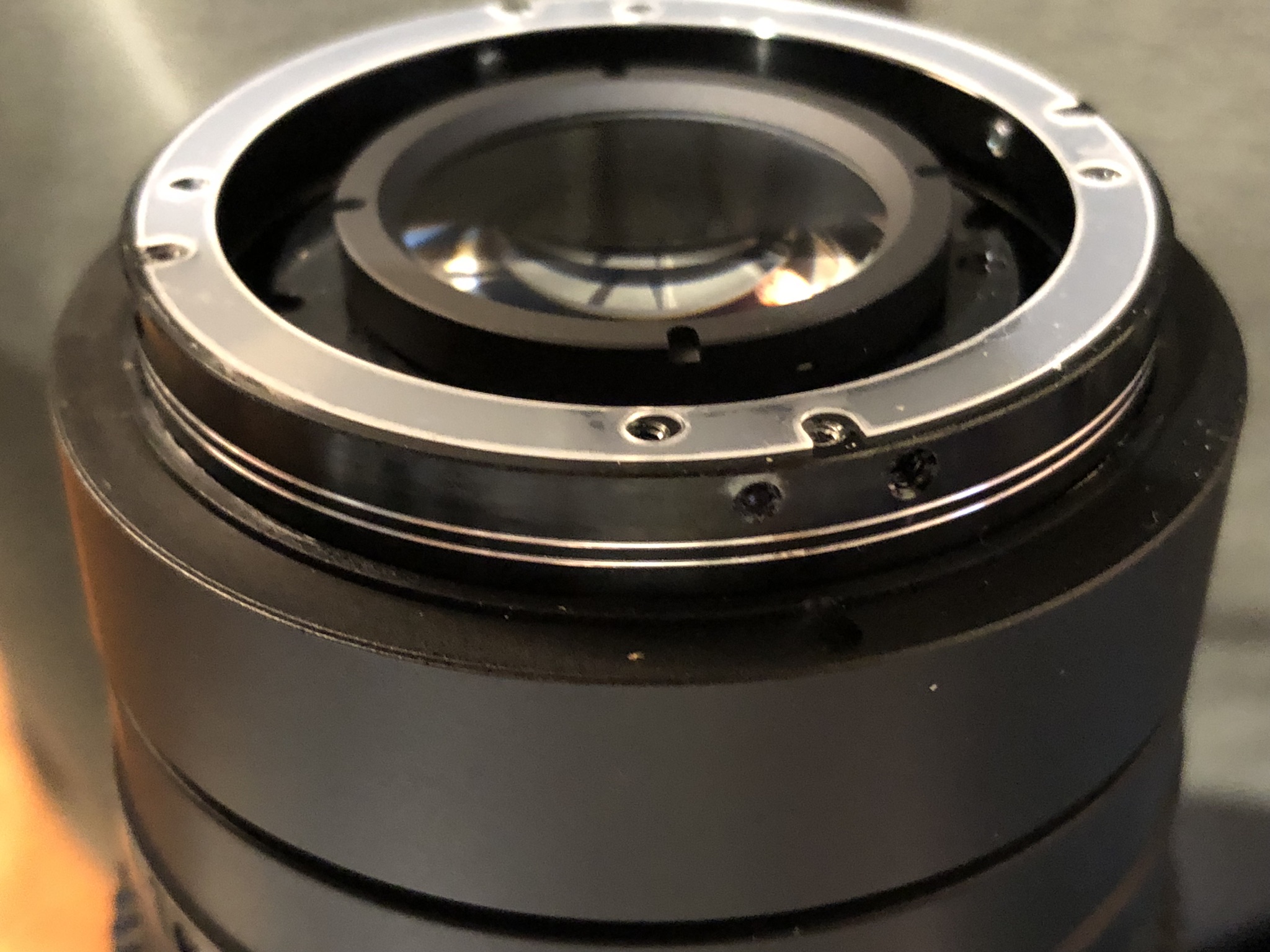 Complex hole patterns on the end of the MK lens for collar and mount attachments