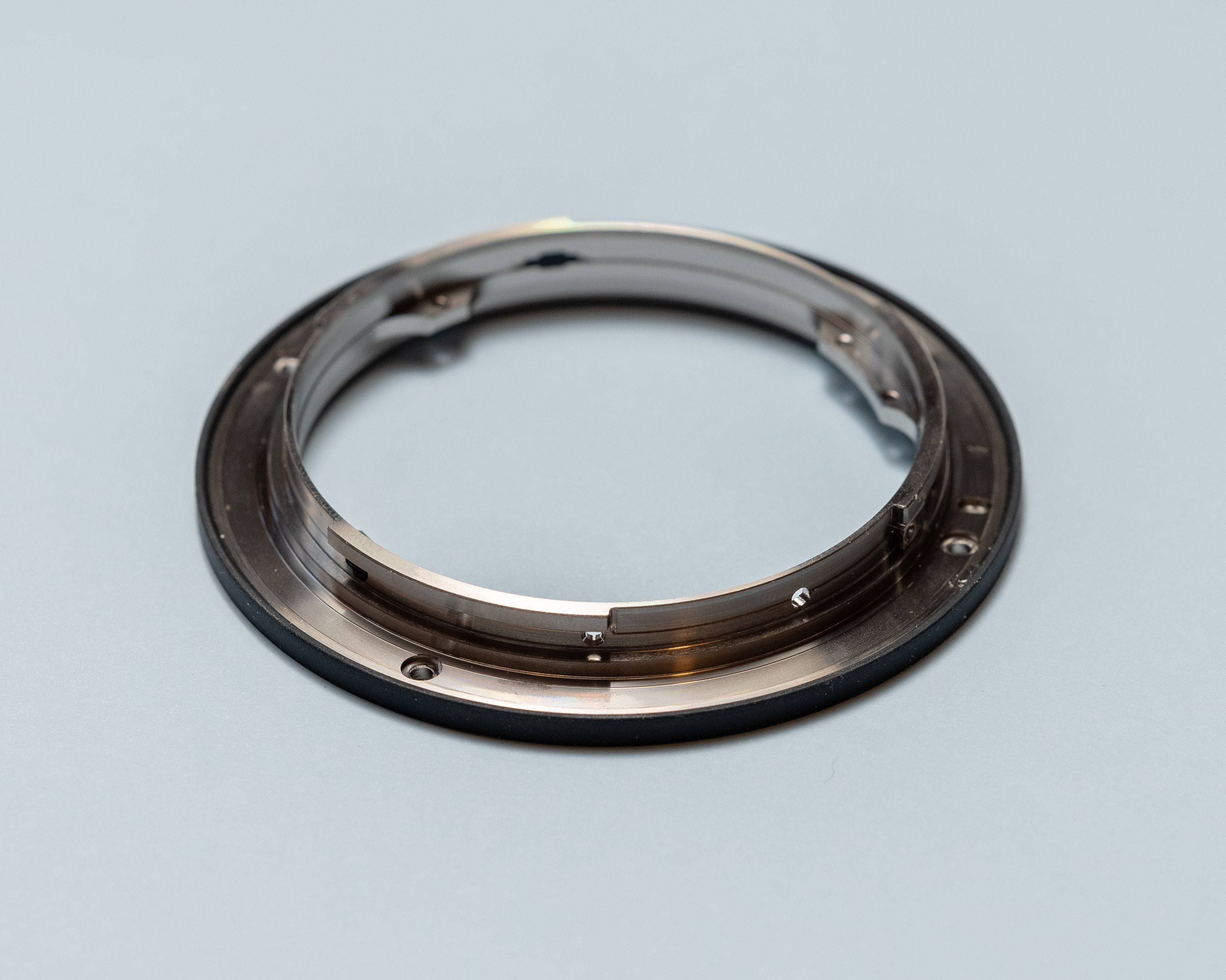 Machined metal ring with 3 overhang features for retention