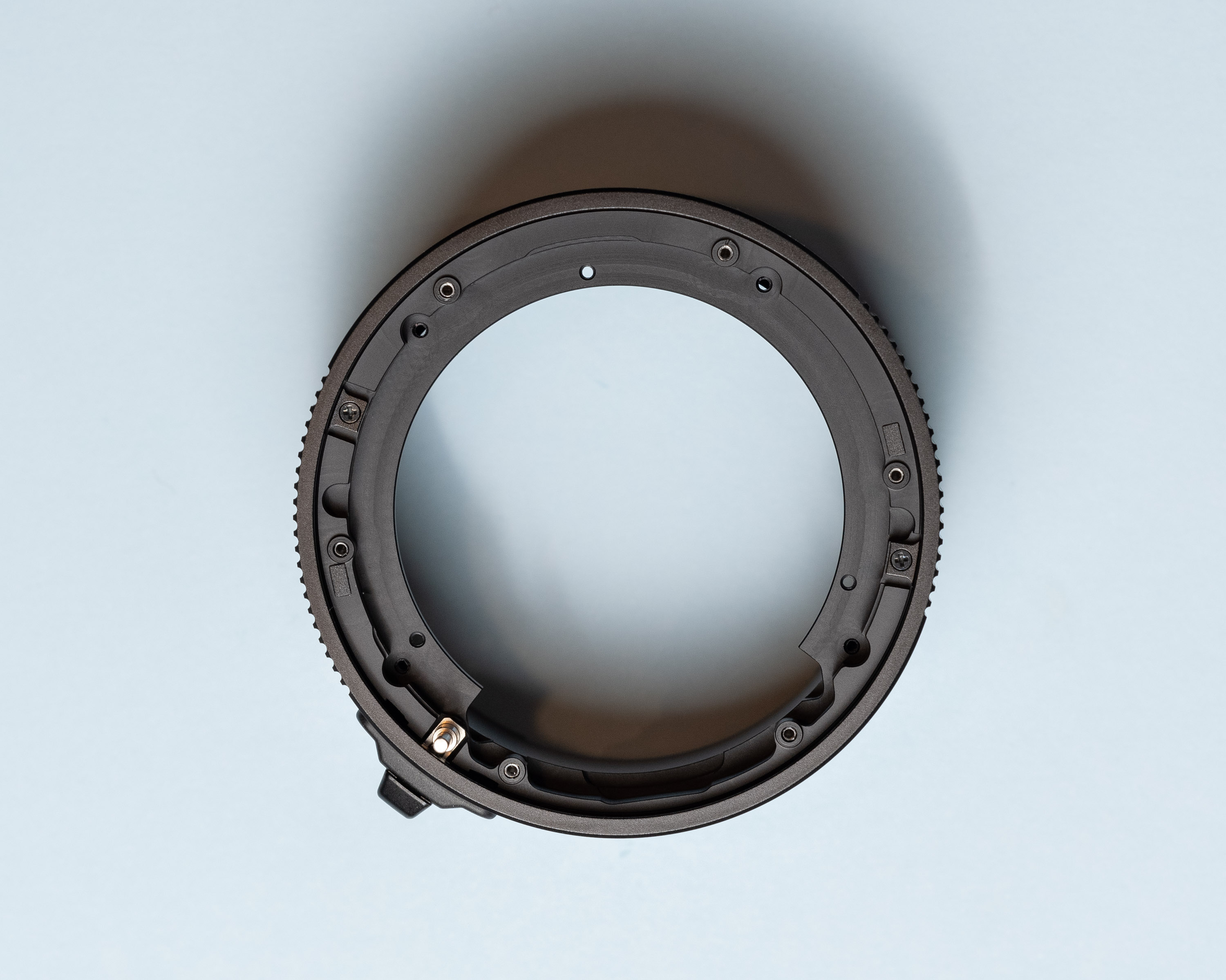 Top down view of black anodized extension tube with most parts removed